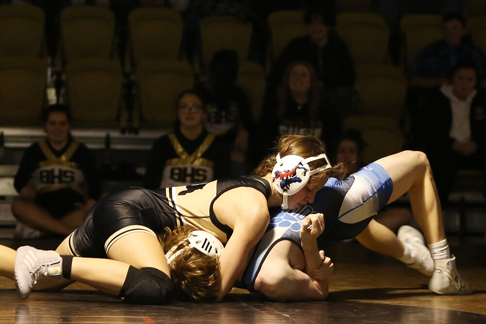Teila Peters pushes Douglas opponent Nolan Smith to the mat